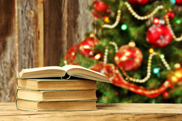 Canvas Print - xmas tree and wooden wall with books 