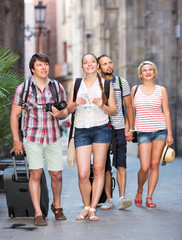 Wall Mural - tourists with map and camera