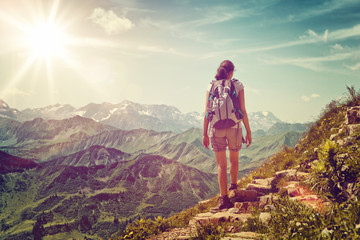 Wall Mural - female hiker ascending steep mountain trail
