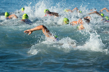 Group People In Wetsuit Swimming At Triathlon