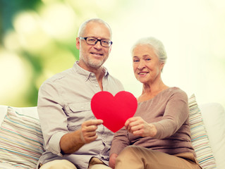 Canvas Print - happy senior couple with red heart shape