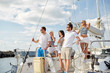 © Syda Productions - smiling friends sailing on yacht