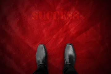 Wall Mural - Black shoes on red carpet