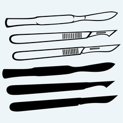 Wall Mural - Medical scalpels. Isolated on blue background
