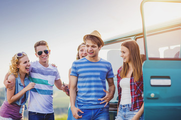 Wall Mural - Young hipster friends on road trip