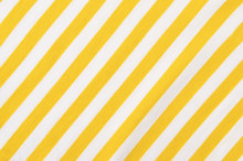 White And Yellow Striped Background. Diagonal Stripes Pattern On Fabric.