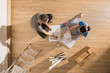 © jackfrog - top view couple sitting on floor thinking on decorating home