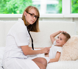 Sticker - doctor examining boy with stethoscope