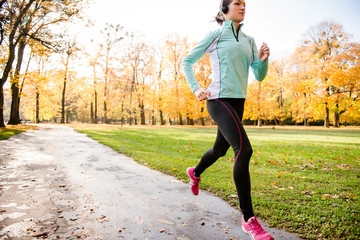 Wall Mural - Woman jogging and listening music