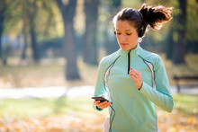 Woman Jogging And Listening Music