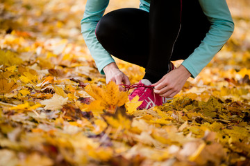 Sticker - Woman tying shoelaces - jogging in nature