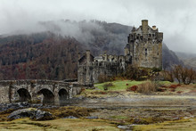 Famous Eilean Donan Castle In Spring Misty Morning, One Of The Most Popular Monuments In Scotland