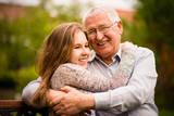 Fototapeta Miasto - Grandfather and grandchild hug