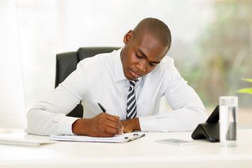 Wall Mural - african american businessman working in office