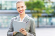 © pikselstock - Businesswoman using digital tablet