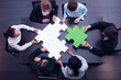 © alotofpeople - business team solving puzzle