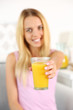 Young beautiful woman with fresh juice