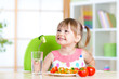© Oksana Kuzmina - Kid eating healthy vegetables meal in home or nursery