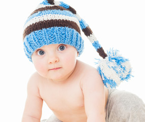 Wall Mural - cheerful baby in the blue hat. Beautiful happy baby . One,isolat