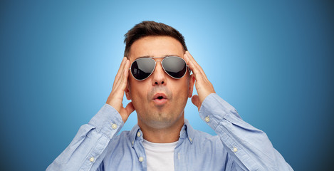 Poster - face of scared man in shirt and sunglasses