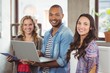 © WavebreakmediaMicro - Happy business people using technologies in office