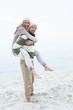 © WavebreakmediaMicro - Smiling man giving his partner a piggy back