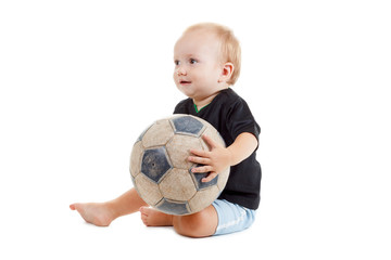 Wall Mural - Kid with a soccer ball. He is very happy.