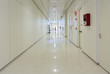 Deep hospital corridor, detail of a white corridor in a hospital