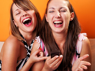 Poster - Young women looking at a cellphone