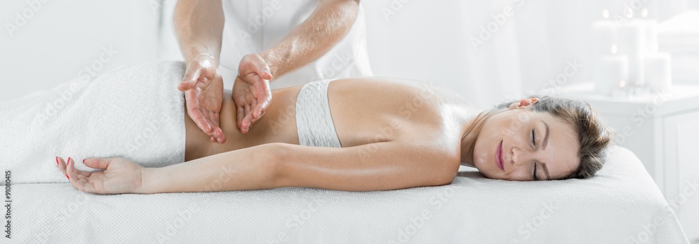 Woman during therapeutic body massage - obrazy, fototapety, plakaty 