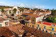 Colonial town cityscape of Trinidad, Cuba. UNESCO World Heritage Site. Plaza Mayor with Santisima church.