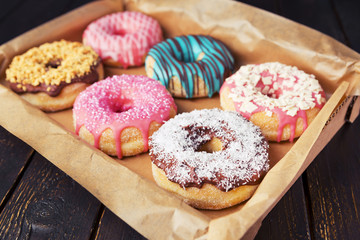 Wall Mural - Fresh homemade donuts with various toppings