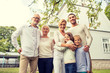 © Syda Productions - happy family in front of house outdoors