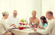 © Syda Productions - smiling family having holiday dinner at home