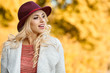 © ZoomTeam - Beautiful elegant woman standing in  autumn park