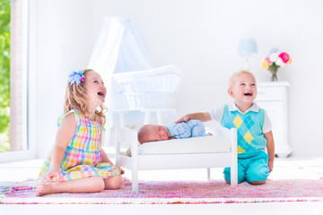 Wall Mural - kids playing with new born baby brother