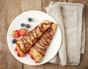 Canvas Print - Crepes with strawberries and chocolate