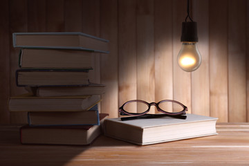 Poster - Lightbulb and books