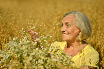 Senior woman with flowers