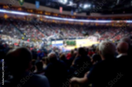 blurred basketball crowd watching game in arena Poster