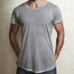 Poster - Muscular guy wearing grey t-shirt