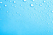 Drops of water on a color background. Blue. Shallow depth of fie
