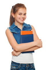 Stylish young girl in a jeans vest and denim shorts with books in hands. Schoolgirl with textbooks. Street style teenager, lifestyle, isolated on white background