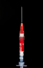 Syringe With Red Fluid