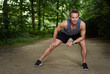 © Flamingo Images - Athletic Man Doing Warm Up Exercise at the Park
