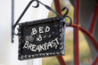 Metal Bed and Breakfast sign on building 