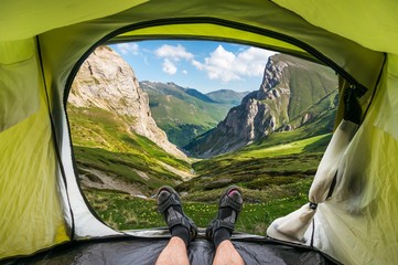 view from inside a tent on the beautiful grassy valley and mount