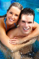 Poster - Young couple relaxing in jacuzzi.