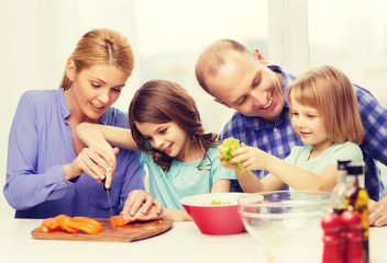 Canvas Print - happy family with two kids making dinner at home