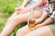 © Syda Productions - close up of friends with beer bottles outdoors